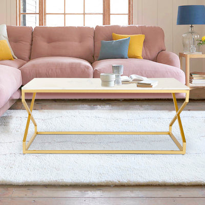 Marble rectangular coffee table with natural white marble top supported by metal legs in gold finish