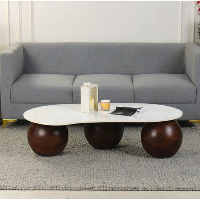 Lifestyle view of fabriano marble coffee table with white marble top and dark walnut base