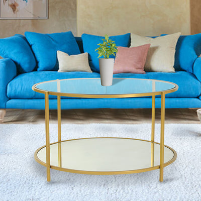 Round glass coffee table with two-tiered shelf top with glass and bottom with mirror, supported by iron legs in gold finish