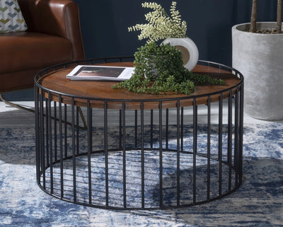 Round coffee table with wooden top supported by metal frame in black finish