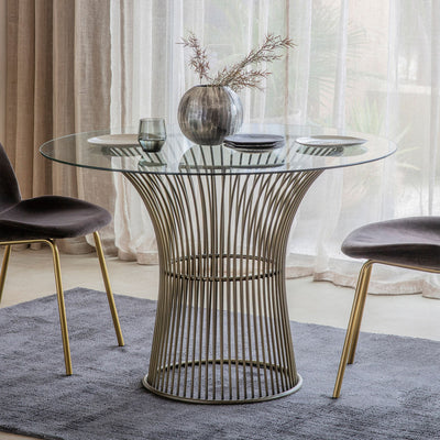 4 seater glass round dining table with tempered glass top  and metal legs in gold finish