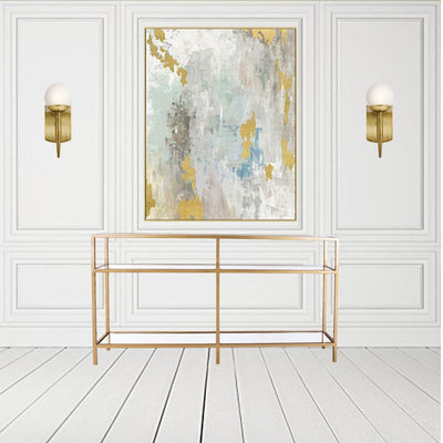 Glass console table contains two-tiered shelf top with glass top and bottom shelfs with metal legs in gold finish