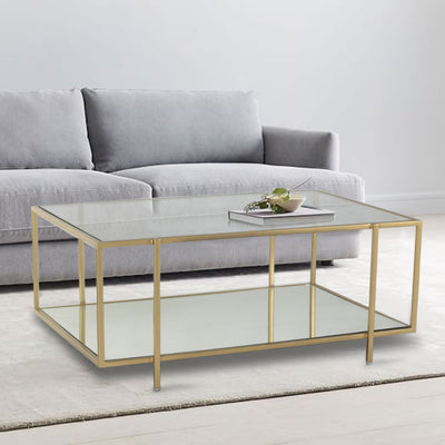Square glass coffee table with two-tiered shelf top with glass and bottom with mirror, supported by iron legs in gold finish