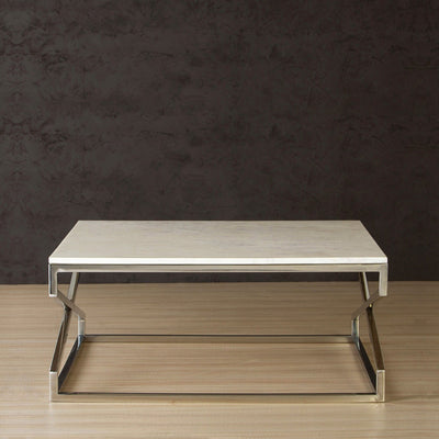 Rectangle coffee table with marble top supported by stainless steel legs in chrome finish
